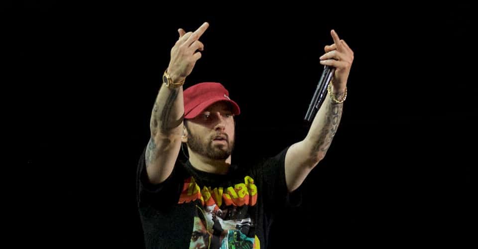 Eminem gives the audience vulgar hand gestures upon leaving the stage after performing on the third day of the Firefly Music Festival in Dover, Delaware